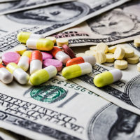 Expensive medicine. Drug addiction. Money and pills.