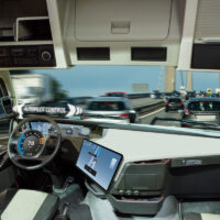 Self driving truck with head up display on a road. Inside view.